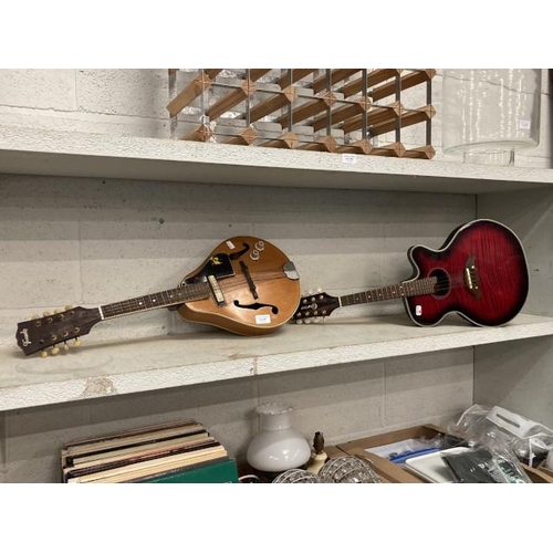 347 - Crafter Model: M70E Serial No: 90501523 electro-acoustic mandolin and a Tenada mandolin