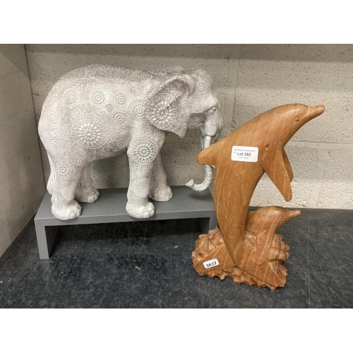 352 - Carved wooden dolphin and a resin elephant