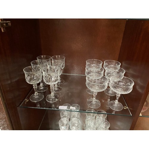 372 - Selection of cut glasses including tumblers, red wine glasses, champagne flutes etc