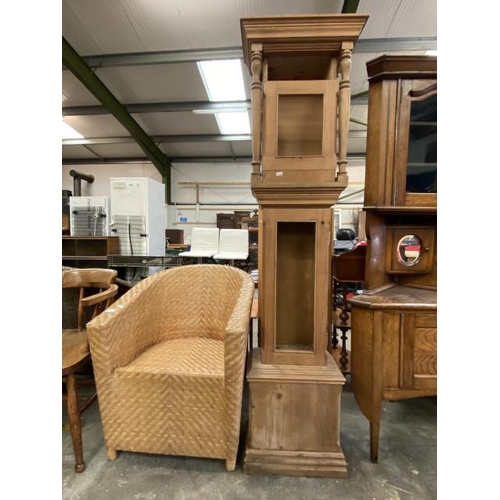 149 - Rattan chair 66W and a pine clock case 183H 48W 26D