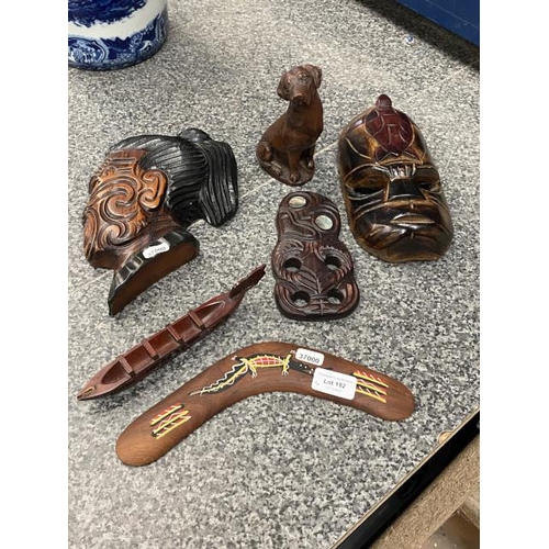 192 - 5 pieces of treen & resin dog inc. 2 tribal masks, boomerang etc.