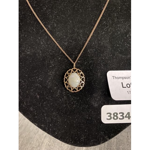 243 - 9ct gold opal pendant on 9ct gold chain