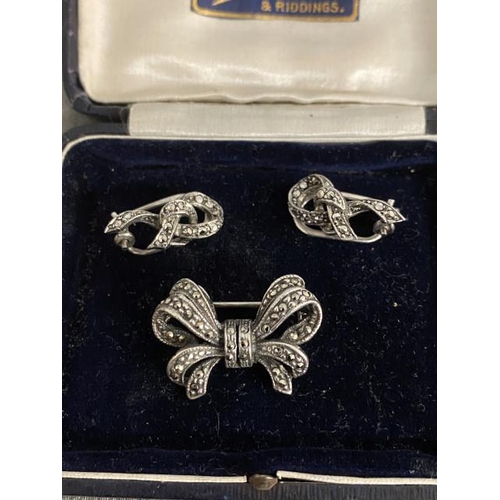 274 - Vintage silver & marcasite 'bow' brooch & pair of silver 'ribbon' clip earrings