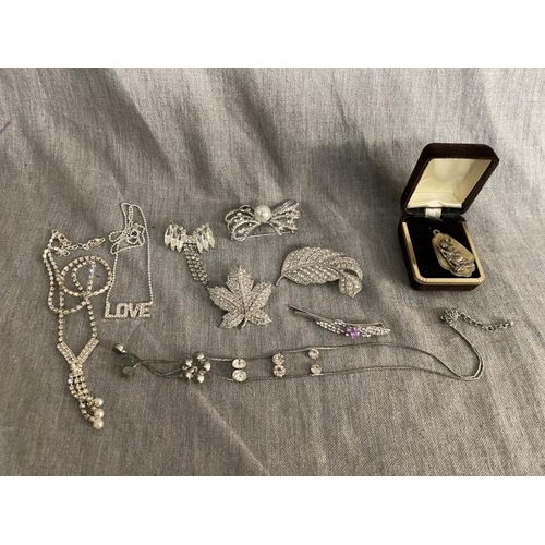 297 - Collection of costume jewellery inc. 4 paste brooches, hair slide, diamante necklace etc.