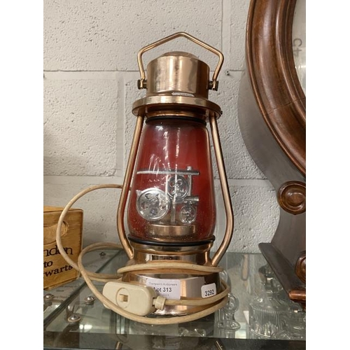 313 - Copper effect electric Tilley lamp with steam locomotive inside