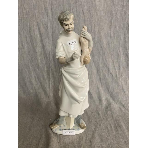 376 - Lladro figurine of doctor with newborn (36H)