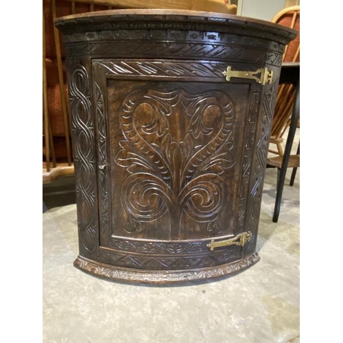 38 - Carved oak corner cabinet with brass hinges 81H 71W 45D