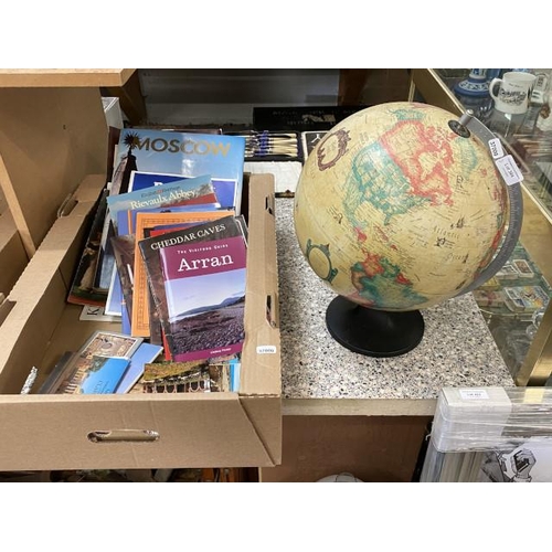 384 - Desk globe & box of tourist books & postcards inc. Arran, Cheddar caves etc.