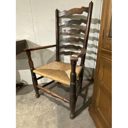 42 - Oak rush seated ladder back carver chair 67W