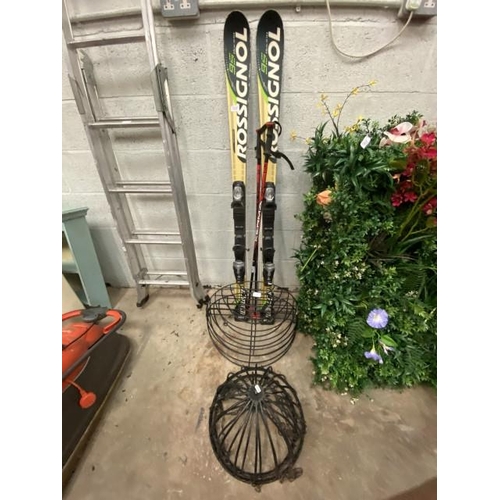 130 - Pair of Rossignol 95 racing skis, pair of Kerma ski poles, 2 hanging baskets and 2 wall mounted plan... 