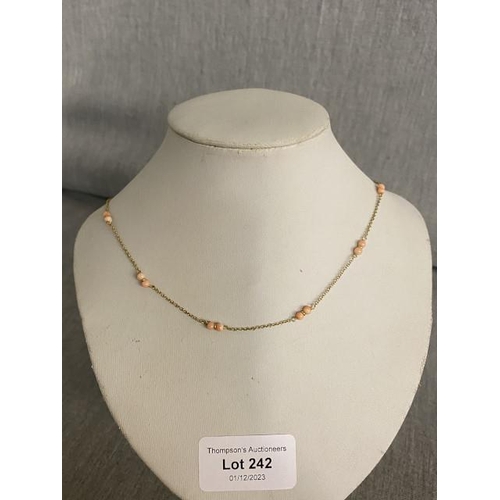 242 - 9ct gold & coral bead necklace 1.2g