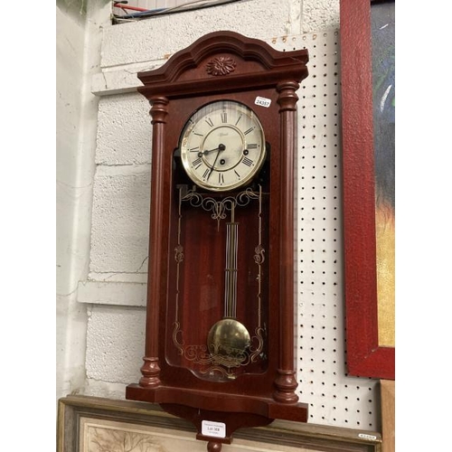 368 - Mahogany effect cased wall clock with pendulum & key