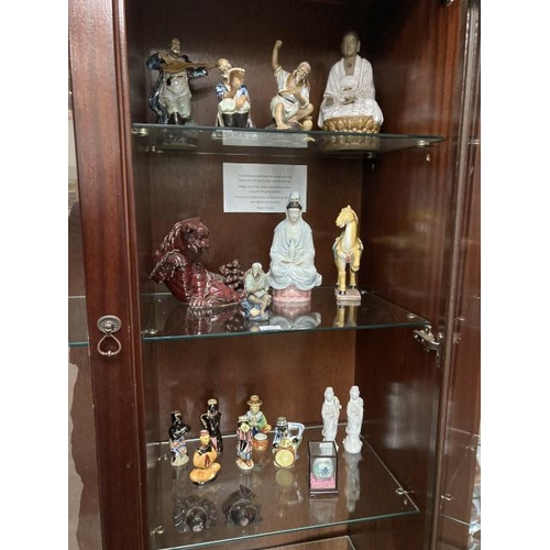 373 - 3 shelves of Japanese figurines, Chinese Foo dog, Tang Dynasty style horse etc.