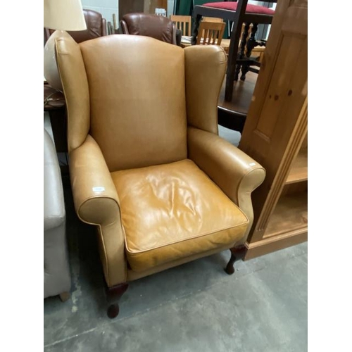 90 - Tan leather Laura Ashley wing armchair 78W