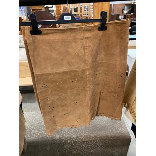 181 - 8 suede skirts (sizes 12 & 14, new - one with broken zip) 2 suede jackets (size 14) 3 leather coats,... 