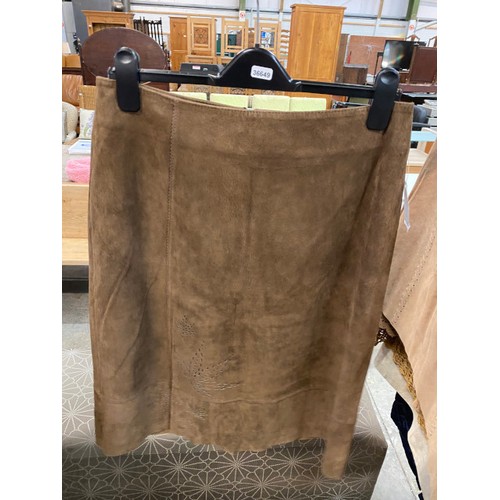 181 - 8 suede skirts (sizes 12 & 14, new - one with broken zip) 2 suede jackets (size 14) 3 leather coats,... 