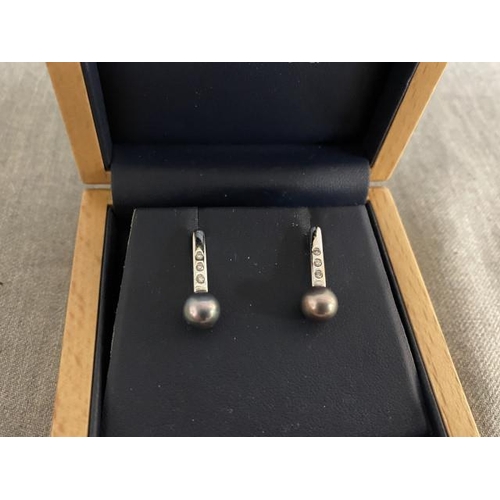 216 - Pair of 9ct white gold 6 diamond & black pearl drop earrings