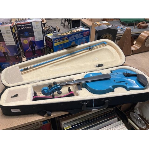 307 - Cased blue violin & bow