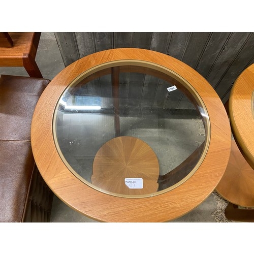 139 - Pair of teak with glass top coffee tables 56H x 50cm diameter