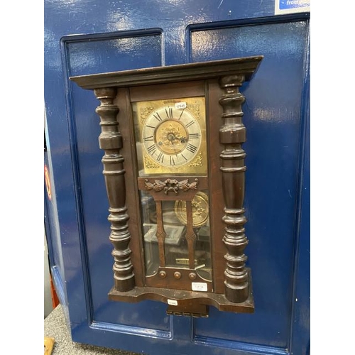 196 - 19th century mahogany cased wall clock with pendulum & key