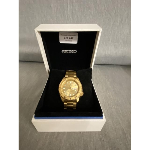 247 - Cased Seiko 5 automatic day/ date gold tone 24 jewels watch (4R36-08E0) with booklets & box