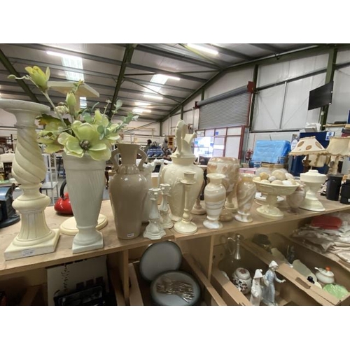 382 - Collection of cream candlesticks, alabaster eggs, plant stands, onyx/ alabaster vases, table centre ... 