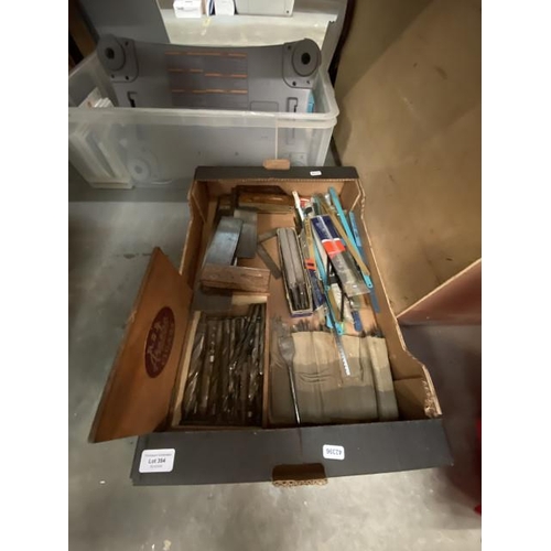 394 - Box containing coping saw blades, carpenter's try squares, files, flat wood drill bits etc.