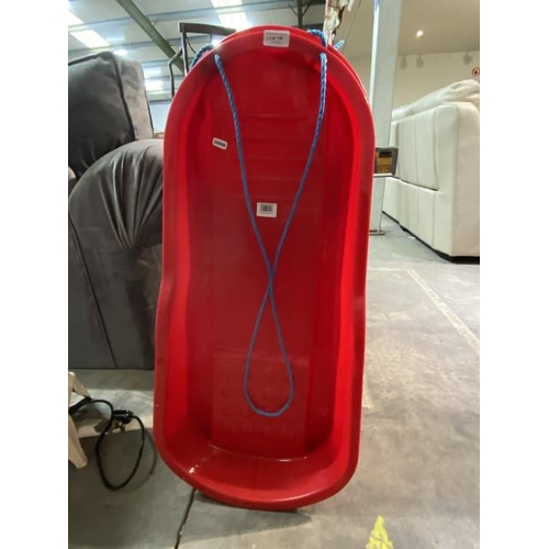 130 - 2 red plastic sledges (new)