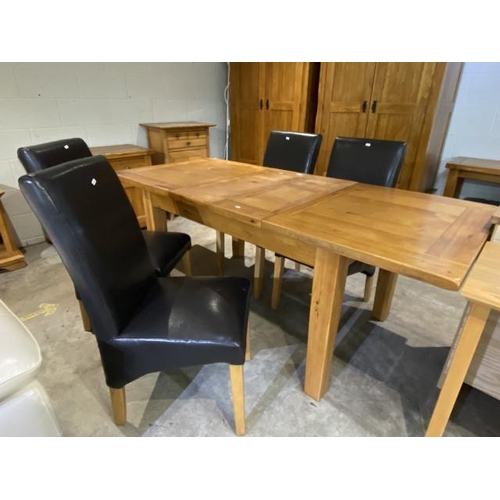 139 - Oak Furniture Land extending dining table 79H 203W 80D and 4 black leather high back dining chairs