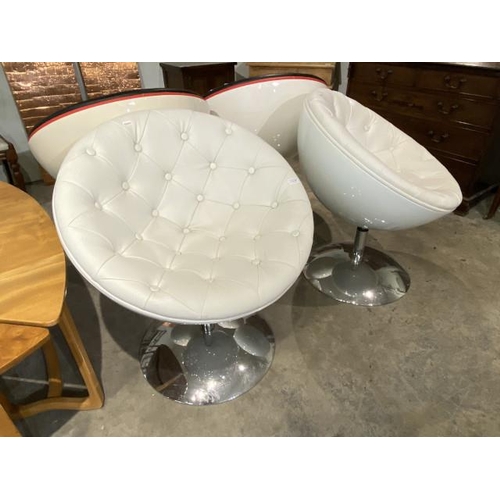 150 - Pair of cream leather button back swivel pod egg chairs 69W