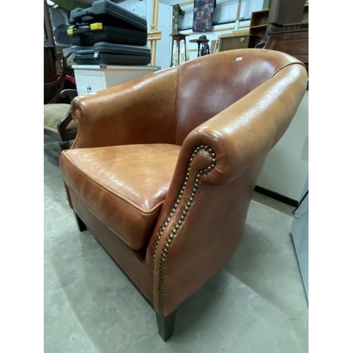 234 - ASSI D'ASOLO, Italian tan leather with brass studs lounge chair 84W