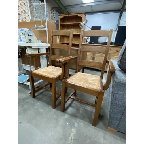 250 - Pair of oak rush seated carver chairs 55W