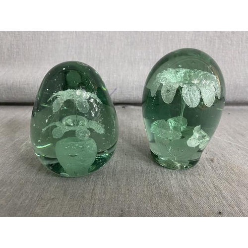 350 - 2 Victorian green glass dumps/paperweights with vase of flowers design 9cm & 10cm H