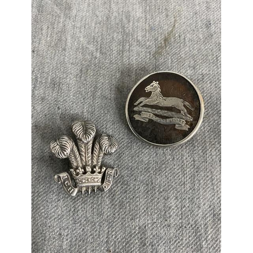 393 - Two WWII Military silver badges