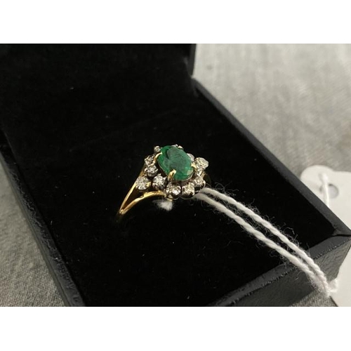 394 - 18ct gold with Columbian emerald and diamond ladies ring (no hallmark but tests for 18ct) 4.3g (Size... 