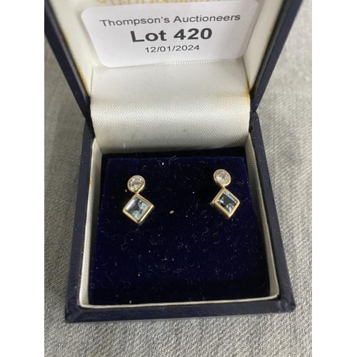 420 - Pair of 9ct gold & blue topaz drop earrings