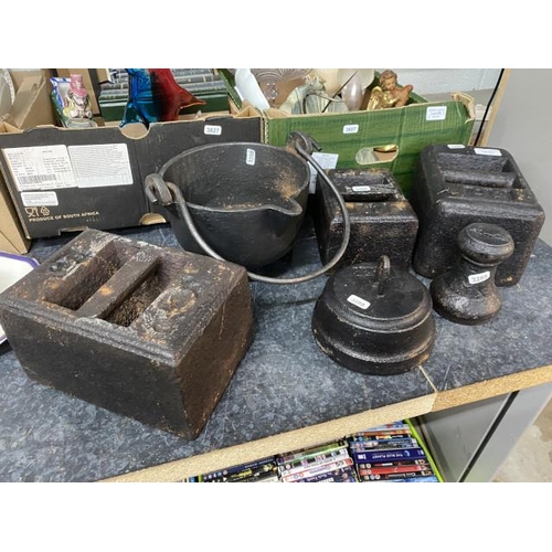 471 - Cast iron cauldron, two 56lb cast iron weights, 28lb cast weight etc.