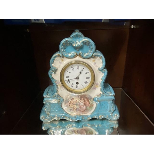 489 - Antique porcelain mantle clock with pendulum & key