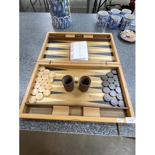 145 - Cased wooden back gammon games set