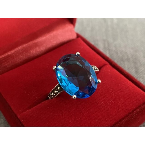 195 - Silver, blue stone & marcasite ring (size R 1/2)