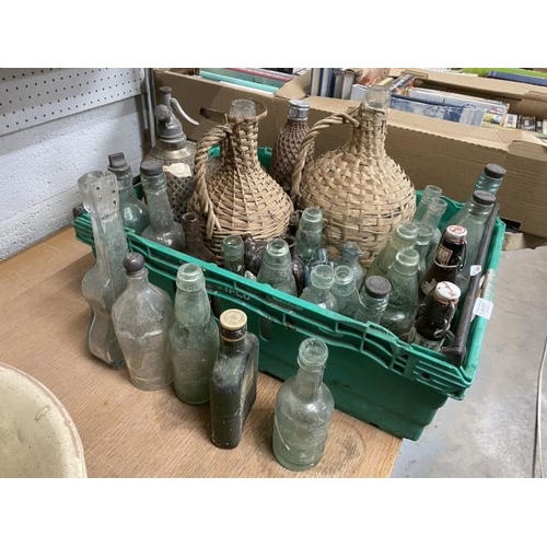 277 - Collection of old glass bottles inc. 2 demi johns,  advertising, soda siphon etc.