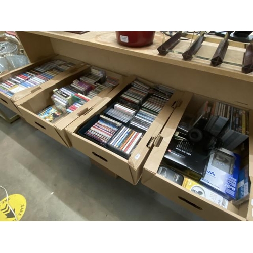4 boxes of audio book cassettes, CD's, Walkman's, Sony headphones etc.