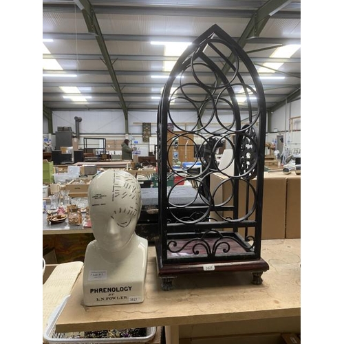 317 - Wrought iron 7 bottle wine rack & phrenology head