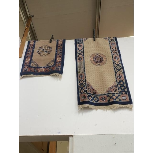 378 - 2 oriental rugs 62 x 98cm & 67 x 144cm