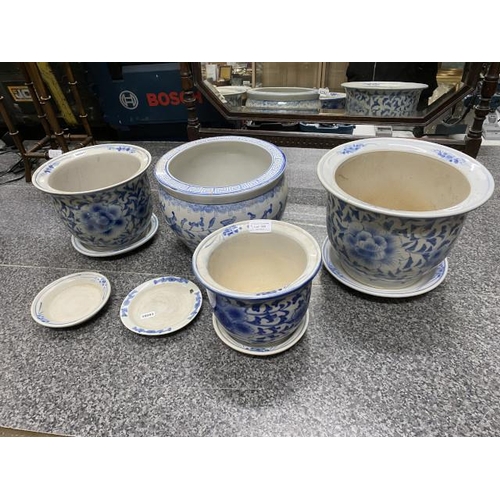 189 - Blue & white Chinese style fish bowl & 3 blue & white planters with 5 saucers