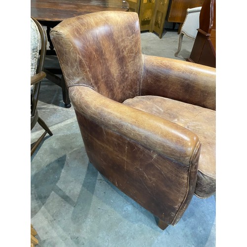 65 - Distressed look brown leather tub chair 73W