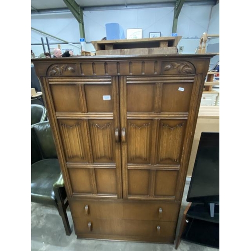 176 - Oak linen fold 2 door/2 drawer cupboard 145H 88W 48D