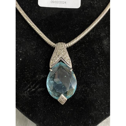 264 - 925 silver, blue stone & marcasite pendant on silver chain (chain 35.2g)