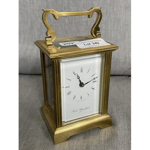 340 - Brass Robert Blandford carriage clock with key made in England, 7 jewels