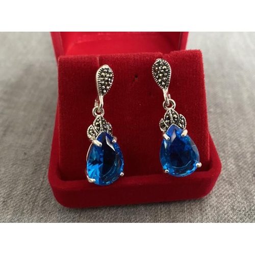 281 - Pair of silver, blue stone & marcasite earrings